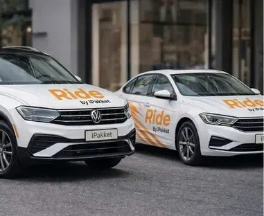 Two Ride by iPakket carsharing vehicles parked side by side in New York City