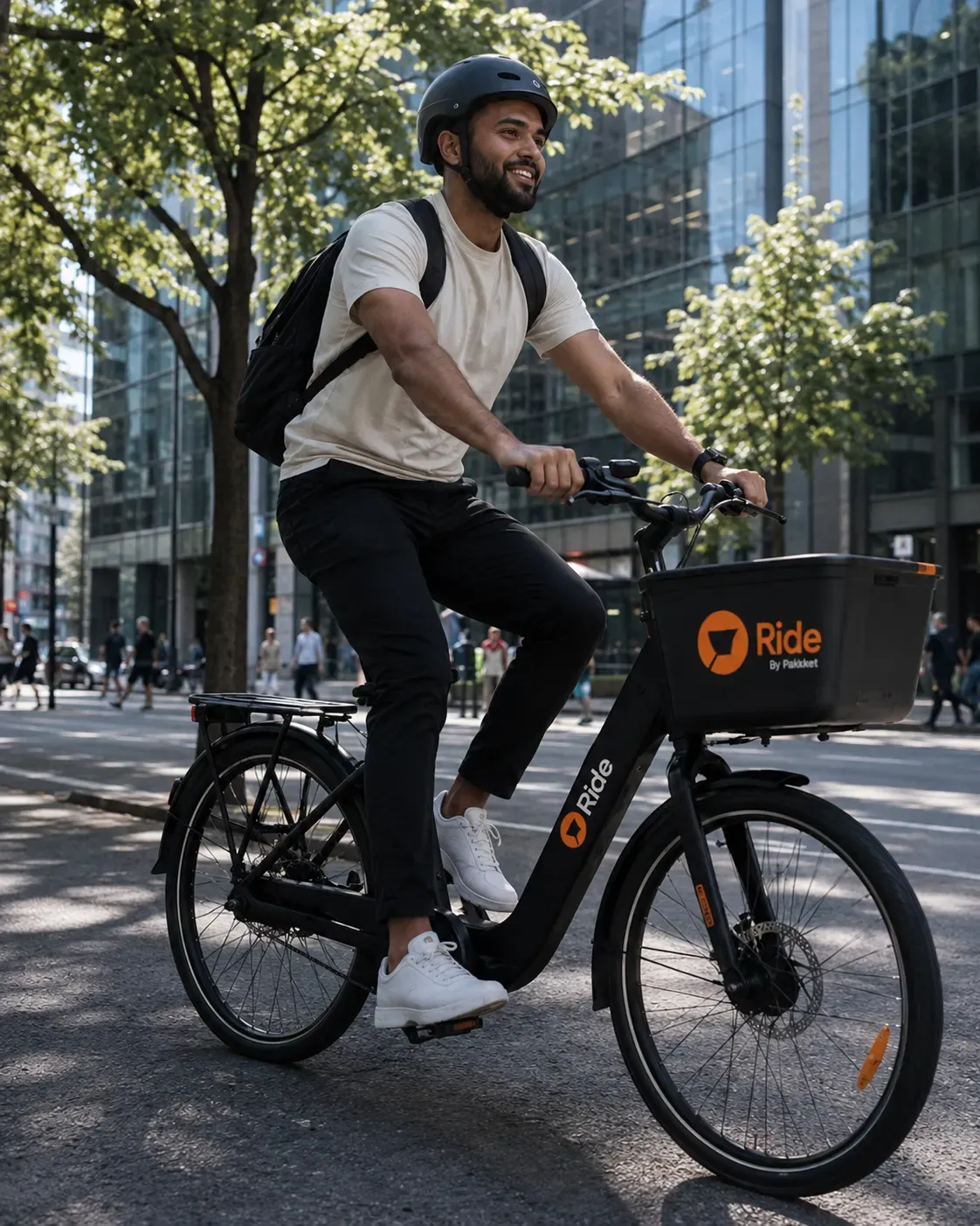 Rider on a Ride e-bike in a tree-lined city street