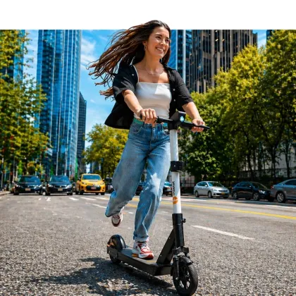Rider on an iPakket e-scooter on a city avenue